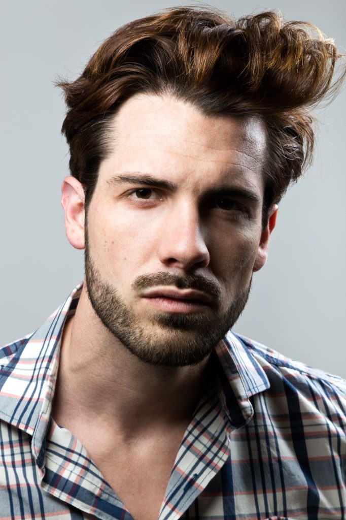 An image of an Elegant young man in a Mens Haircuts in Stafford.