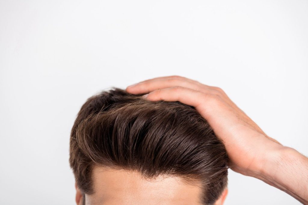 Man receiving a Mens Toupee Stafford fitting, highlighting expert hair loss treatment in Stafford.