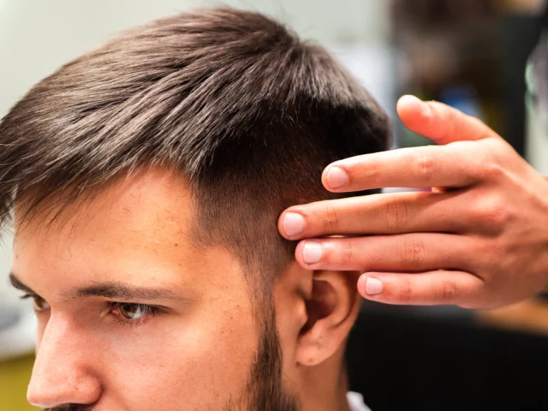 Precision haircut showcasing realistic mens wig Stafford in barbershop setting with expert styling and clean fade detail.